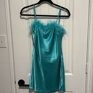 100% polyester dress in size small. Backless dress never been worn.